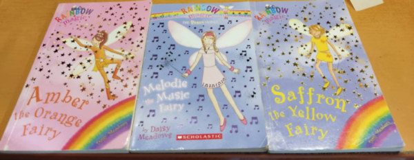 3 db Rainbow Magic: Amber the Orange Fairy + Melodie the Music Fairy + Saffron the Yellow Fairy